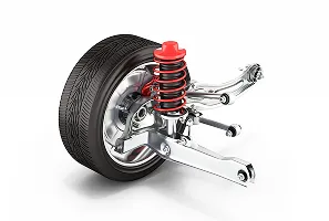 Un pneu de voiture et une suspension avec amortisseur rouge sur fond blanc.